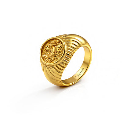 Gold ring with a detailed design on a white background