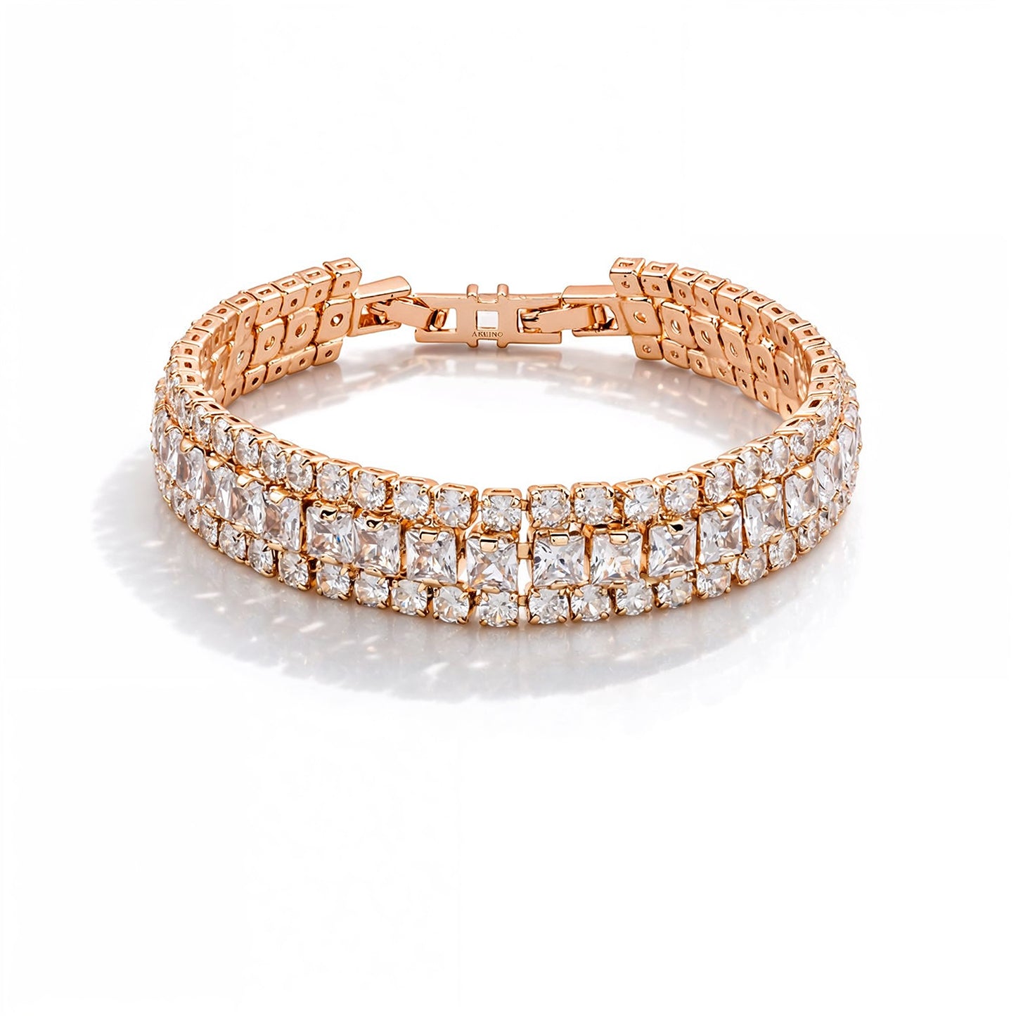 Rose gold bracelet with clear gemstones on a white background