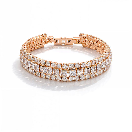 Rose gold bracelet with clear gemstones on a white background