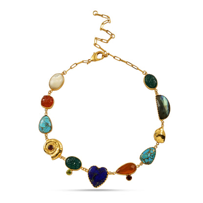 Gold bracelet with colorful gemstones on a white background