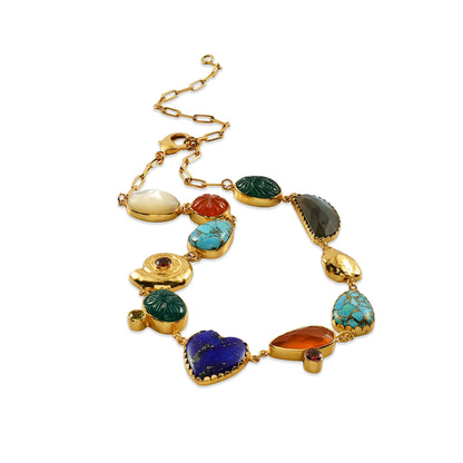 Multicolored gemstone bracelet with gold chain on a white background