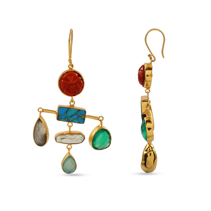 Gold earrings with colorful gemstones on a white background