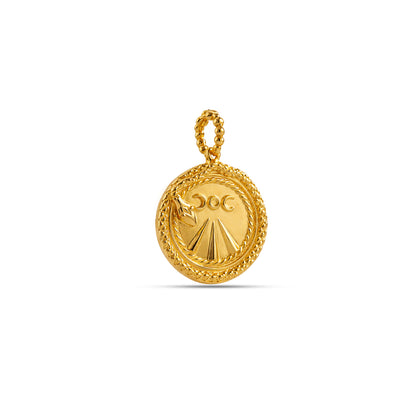 Gold pendant with intricate design on a white background