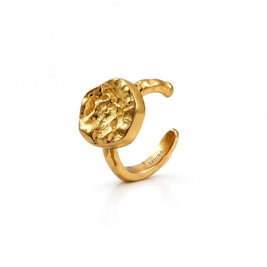 Gold earring with a textured design on a white background