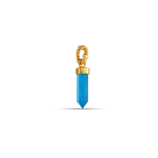 Gold pendant with a blue gemstone on a white background