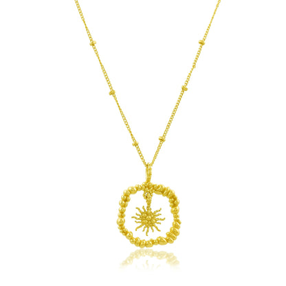 White board shot of Gold plated Granulated Sunburst Necklace by arvino