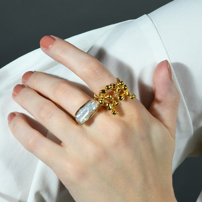 Close Up image of a model stacking Gold plated Ring by arvino