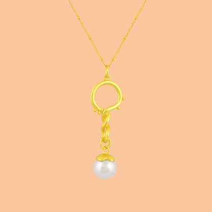 Creative image shot of Dewy Pearl Twist Necklace by arvino on a peach color background