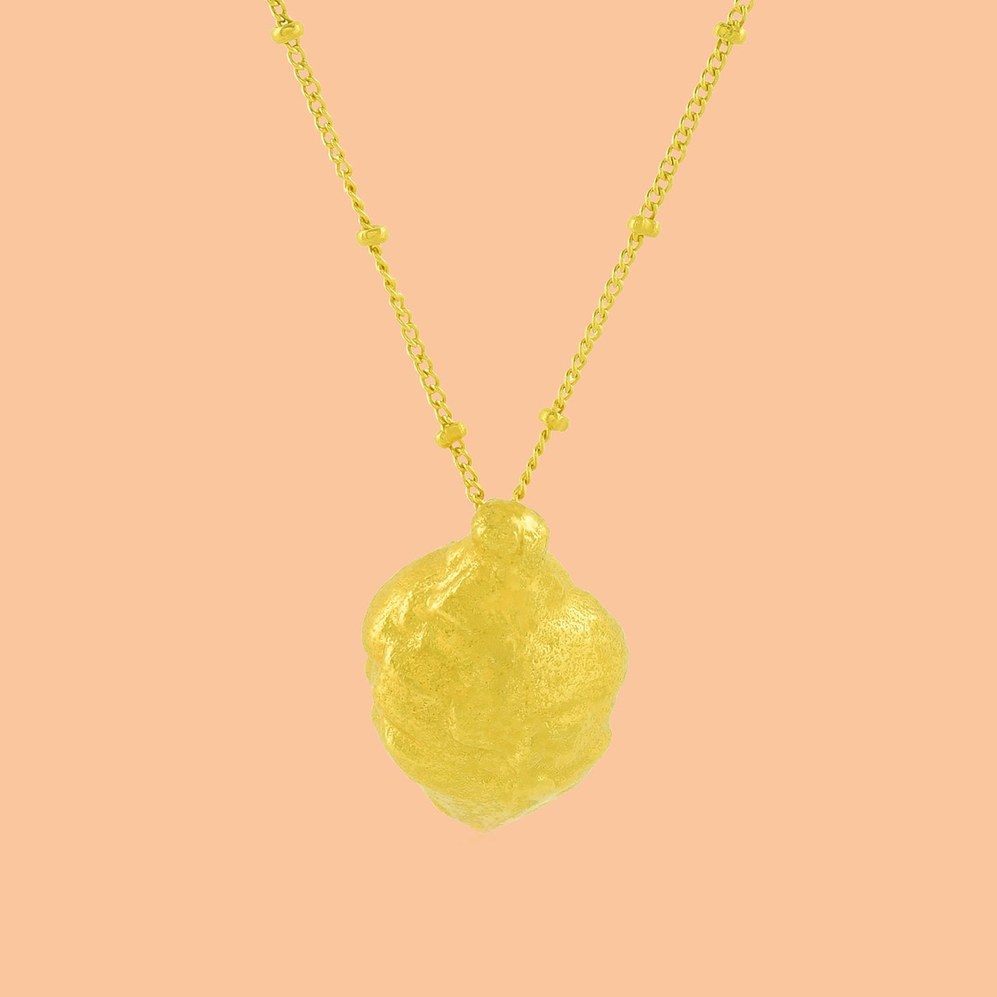 Ethical Foliage Necklace By Arvino on a stable background, Gold Plated necklace