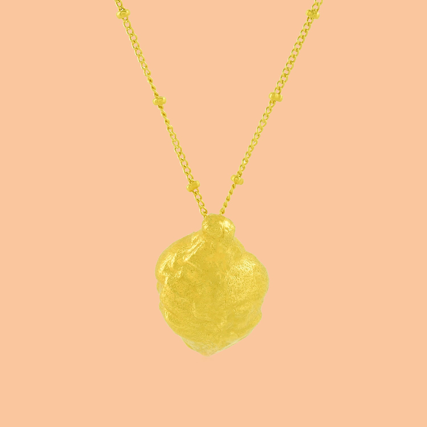 Ethical Foliage Necklace By Arvino on a stable background, Gold Plated necklace