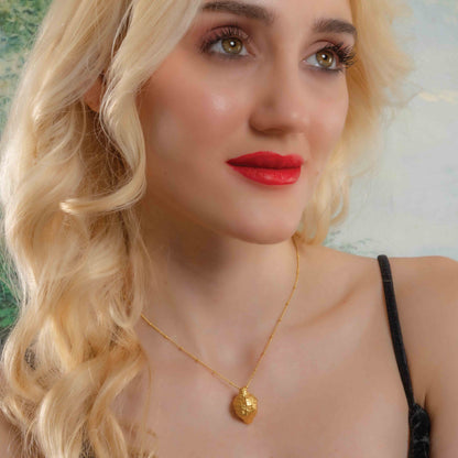 Model wearing Ethical Foliage Necklace by arvino. Best 22kt gold plated necklace