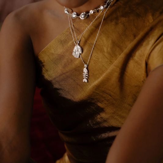 Model Shot of a Person wearing Fish bone necklace by arvino