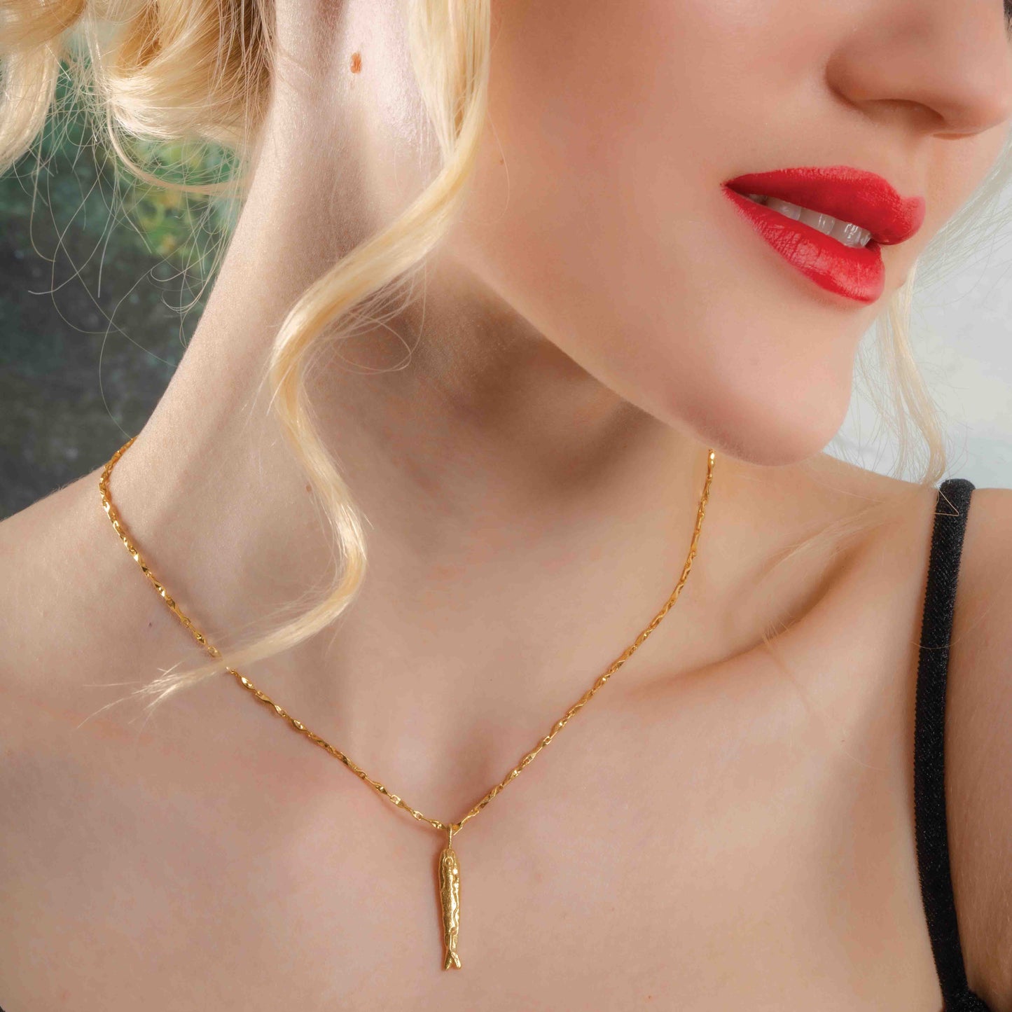 Model Wearing Fish Charm Necklace By Arvino. Premium 22kt Real gold Plating Necklace By Arvino