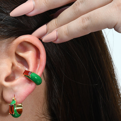 Close up model shot of Garnet Forest Huggies Earrings by Arvino