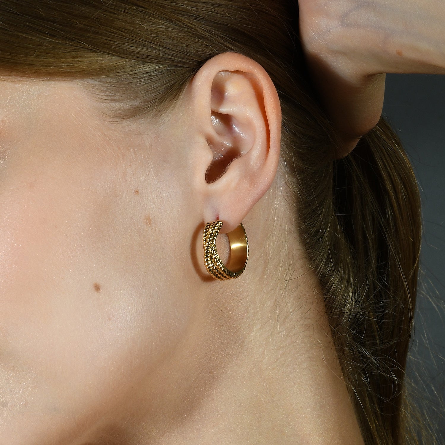 Model image of Intertwined Rope Huggies Earrings