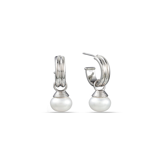 A pair of sterling silver hoop earrings with pearls attached to them, displayed against a white background.