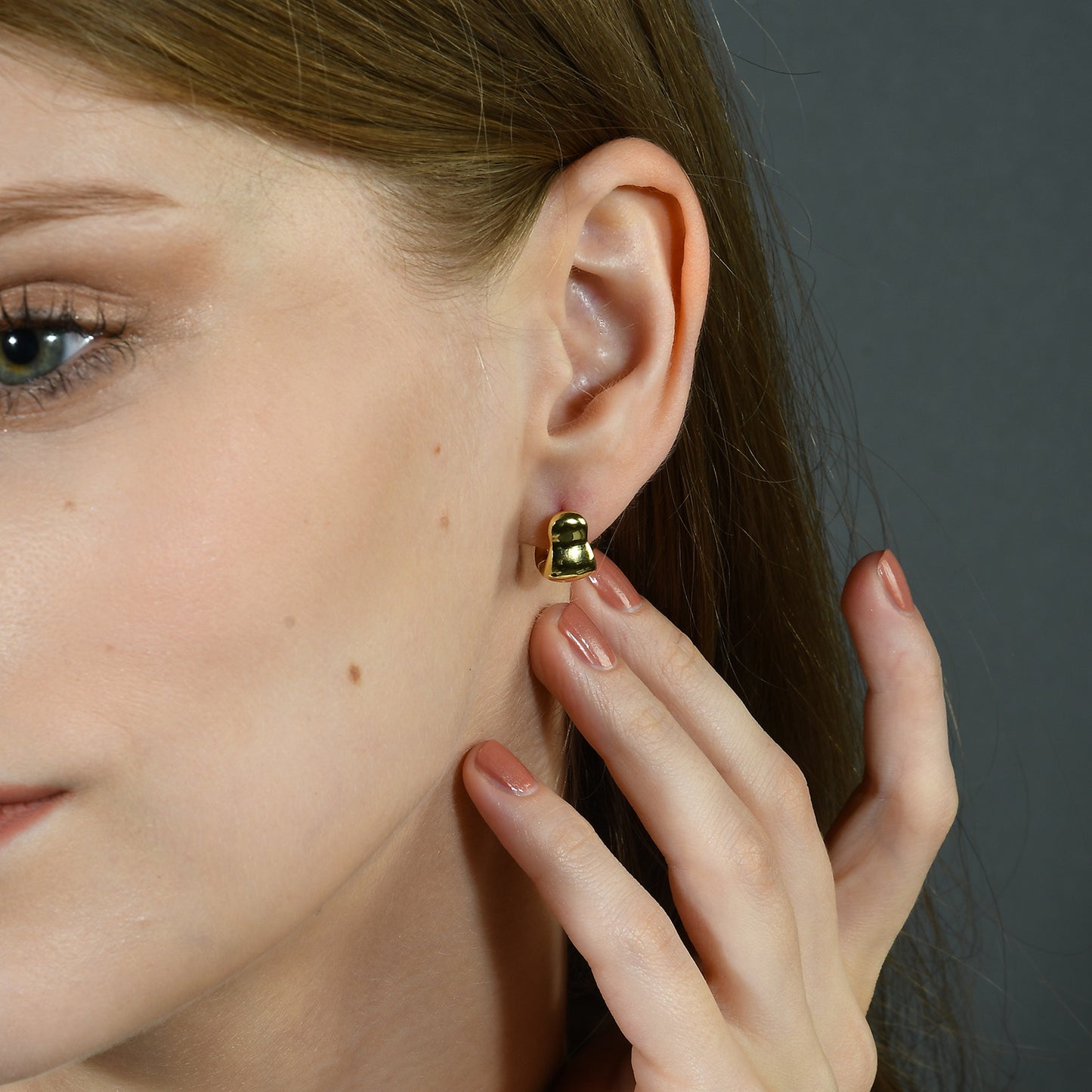 Close Model image in which model is wearing Mini Euphoria Huggies Earrings by arvino