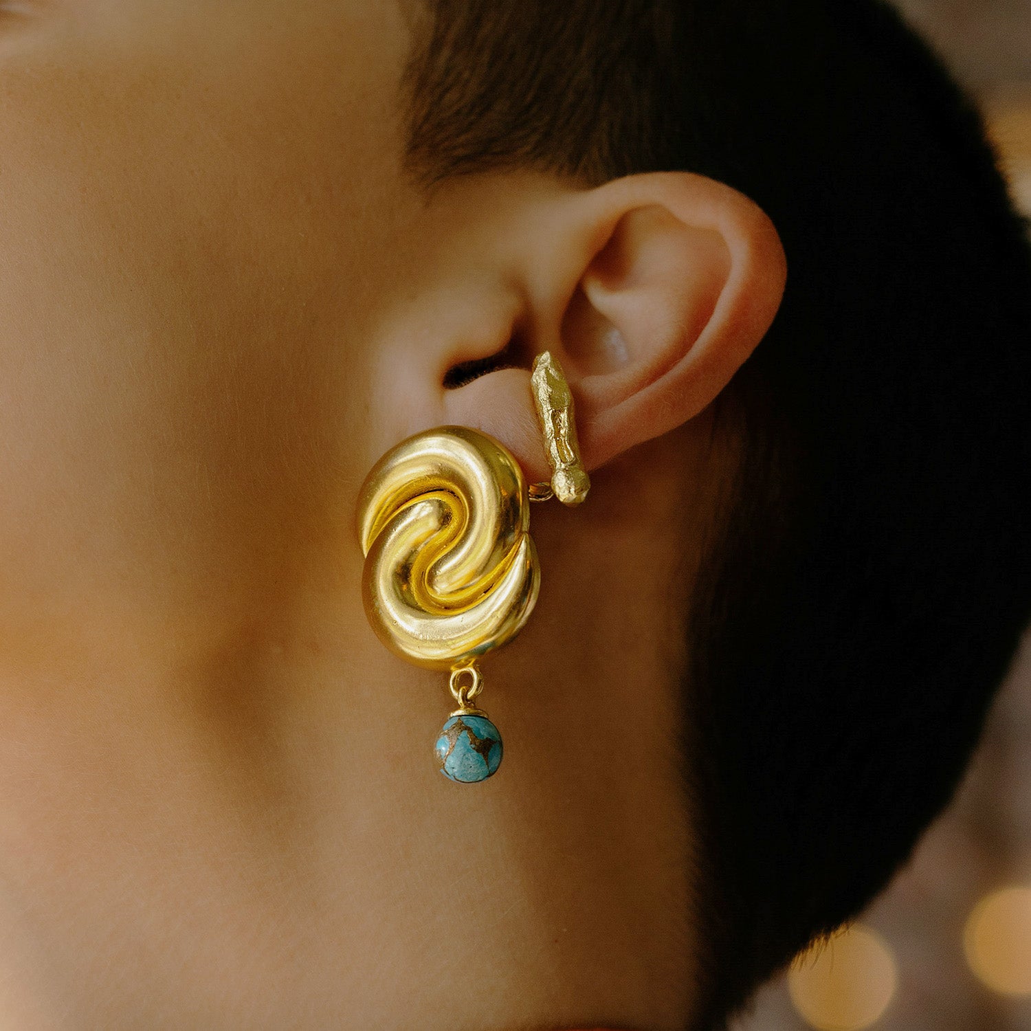 Model stacking Monolith Stud Earrings By Arvino. Gold plated Earring By Arvino