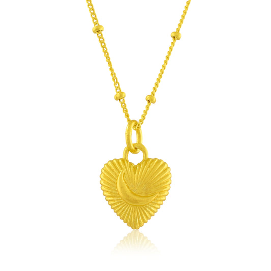 Gold heart-shaped pendant necklace on a white background