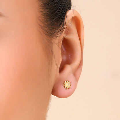 A person wearing a Gold plated stud earring with a Little Labradorite Stone