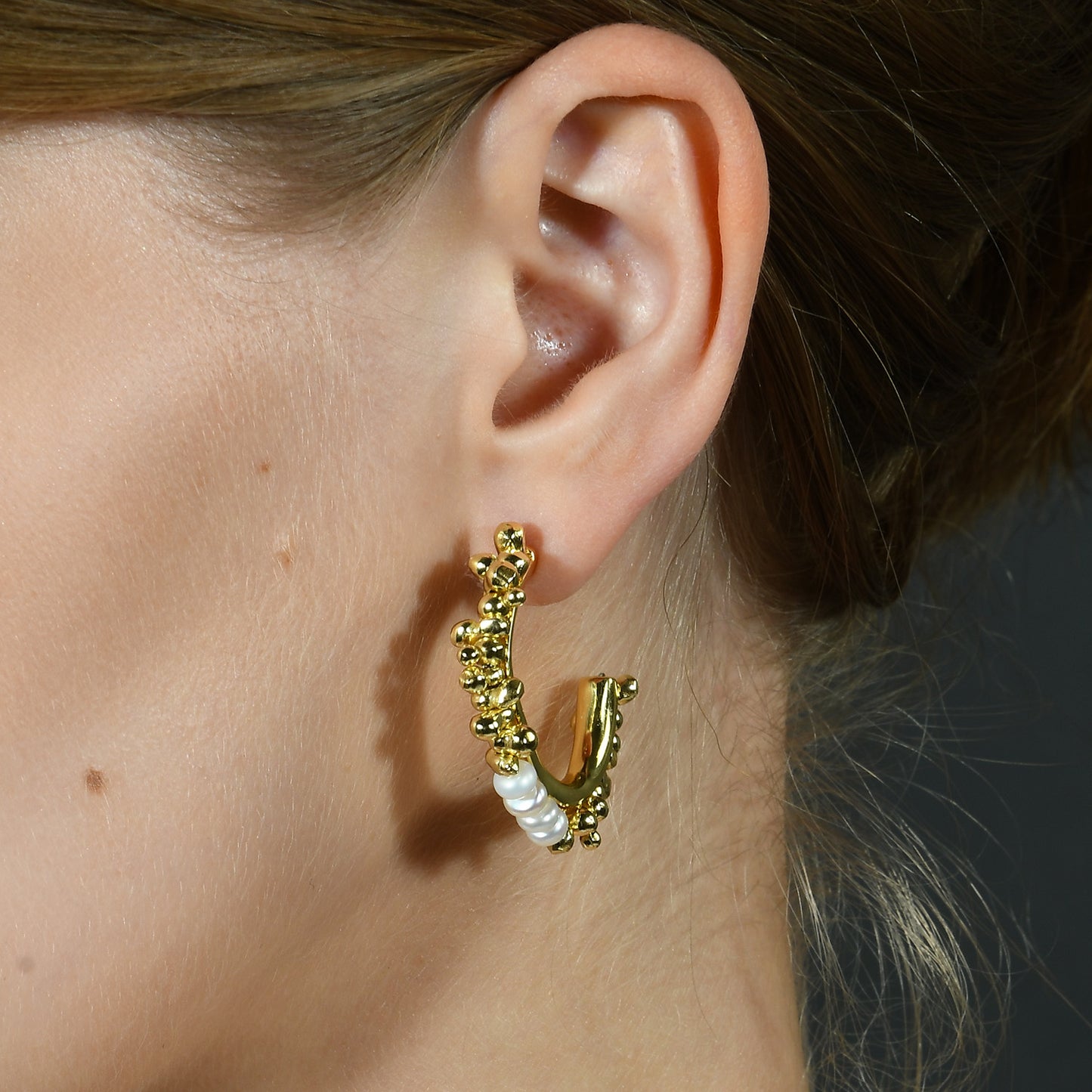 Close up Shot of model wearing Pearl Pallet Hoop Earrings by Arvino