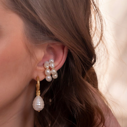close up shot of model showing stack of Pearl Weave Earcuffs by arvino. 