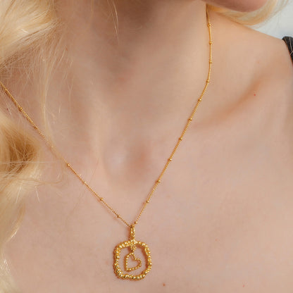 Model Wearing Gold plated Granulated Heart Necklace In 925 Sterling Silver By Arvino