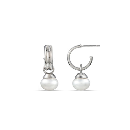 A pair of sterling silver hoop earrings with pearls attached to them, displayed against a white background.
