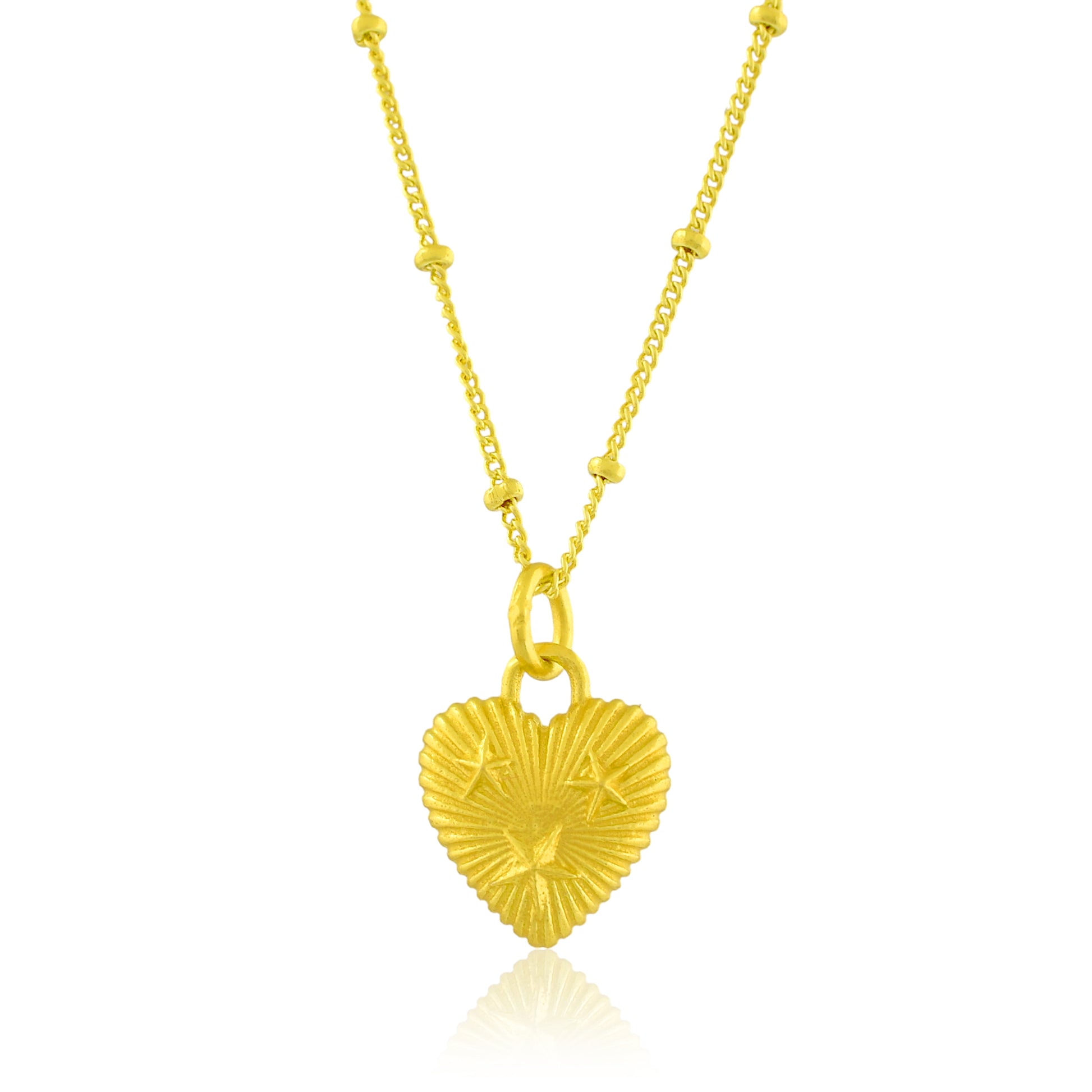 Gold heart-shaped pendant necklace on a white background