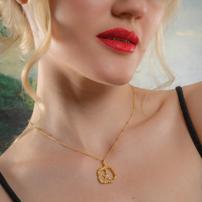Model Wearing a Gold plated Sterling Silver star necklace by arvino