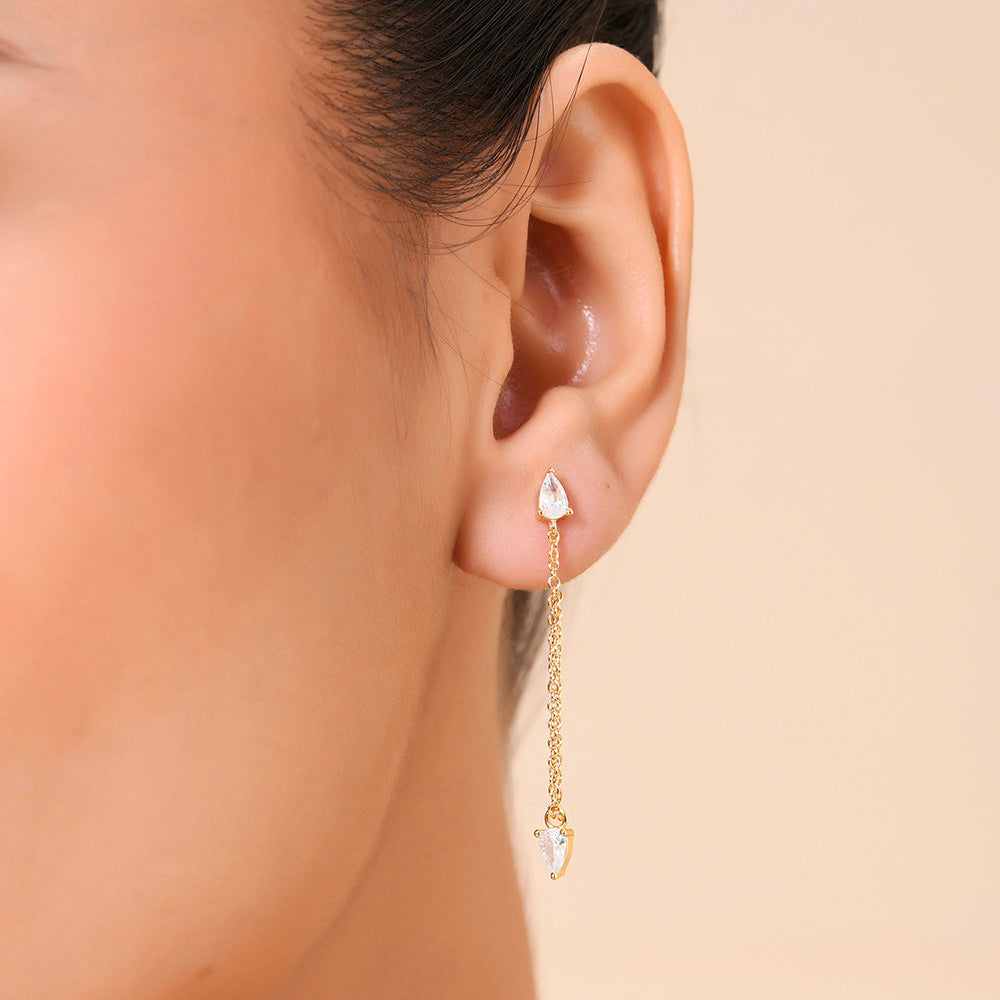 Close image of a model face wearing Zircon Drop Stud Earrings by arvino