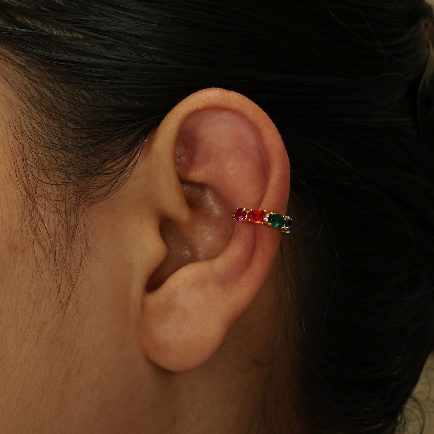 Close up shot of arvino Multihued Crescendo Ear Cuff|Gold plated Earcuff|Demi-fine Earcuff