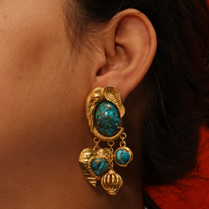 Close up shot of Arvino Turquoise Dream Danglers Earrings made up in 925 sterling and gold plated