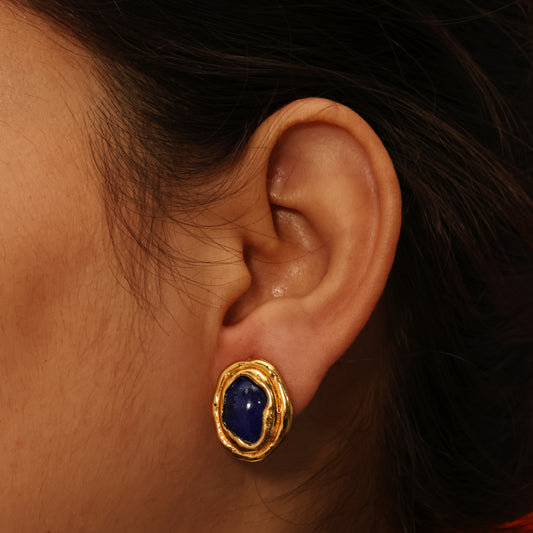 Close up model shot of Arvino Demi Fine Midnight lapis lazuli ocean stud earrings